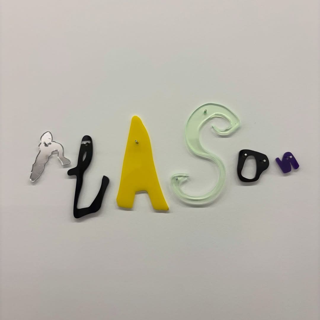 Cut acrylic letters pinned to a wall